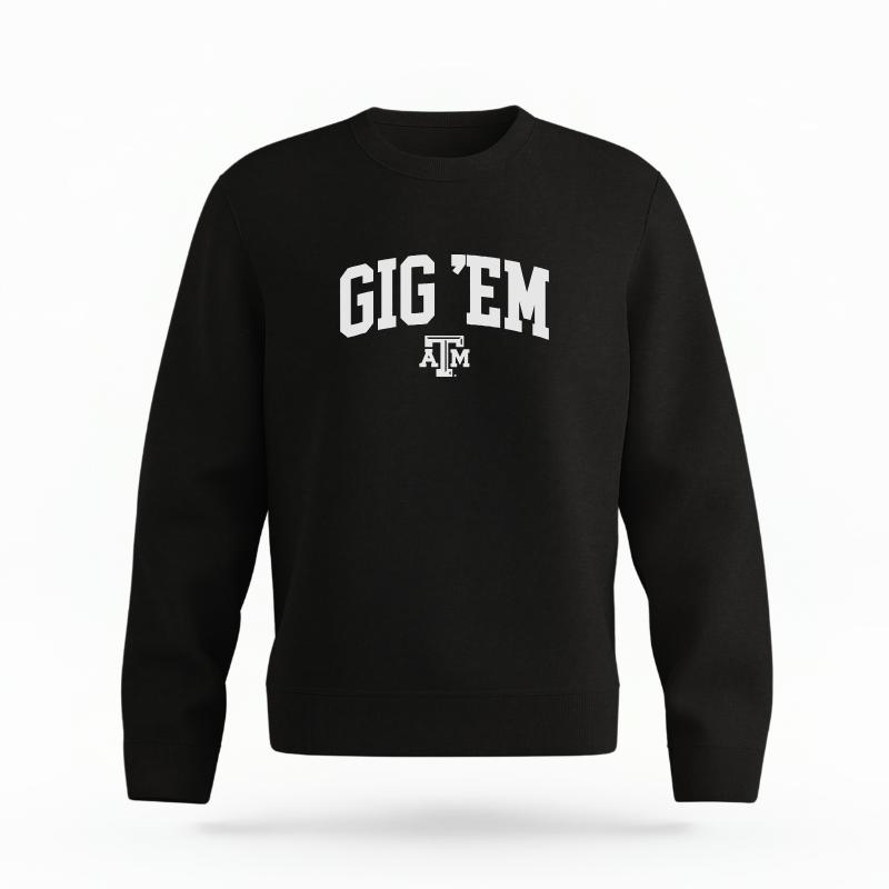 The Black Unisex Gig 'Em Varsity Organic Cotton Crewneck is set against a Ghost - White Studio background. The Gig 'Em Varsity graphic is in a Sports Graphics style.
