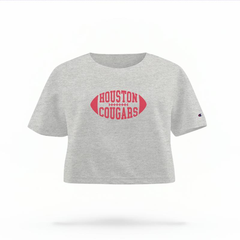 The Heather Grey Female Houston Cougars Football Women's Boxy Crop Top is set against a Ghost - White Studio background. The Houston Cougars Football graphic is in a Varsity style.