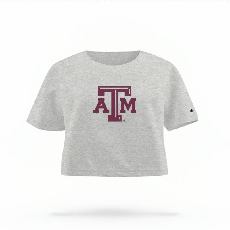 The Heather Grey Female Texas A&M Logo Women's Boxy Crop Top is set against a Ghost - White Studio background. The Texas A&M Logo graphic is in a Logo style.