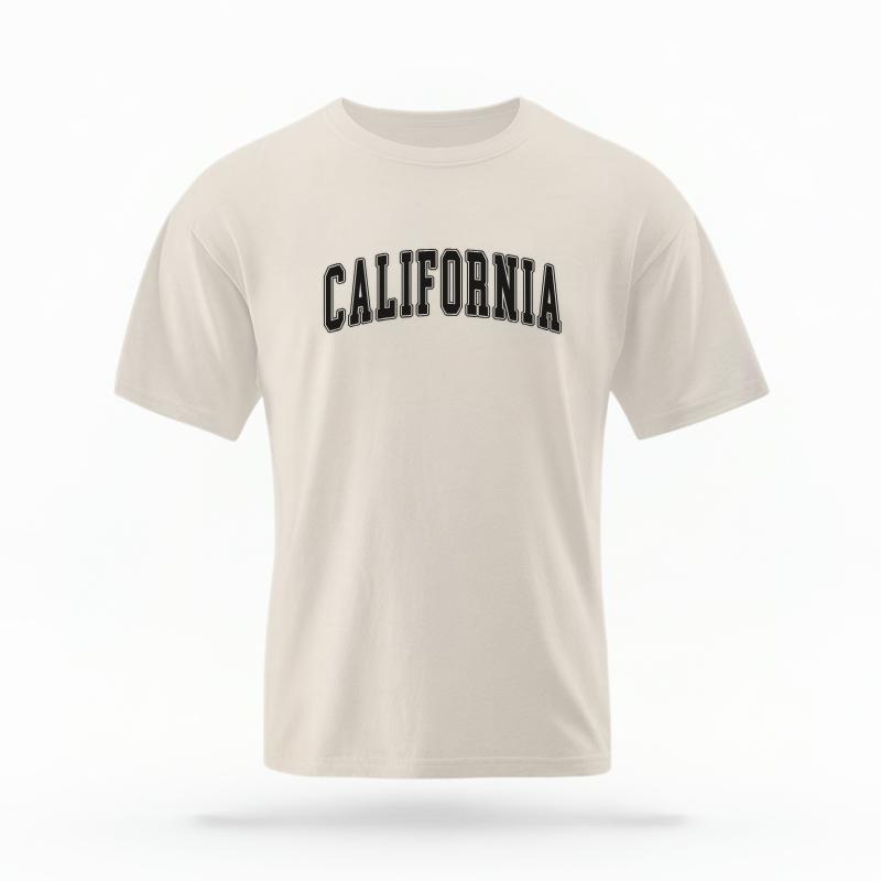 The Ivory Unisex California Varsity T-shirt is set against a Ghost - White Studio background. The California Varsity graphic is in a Varsity style.
