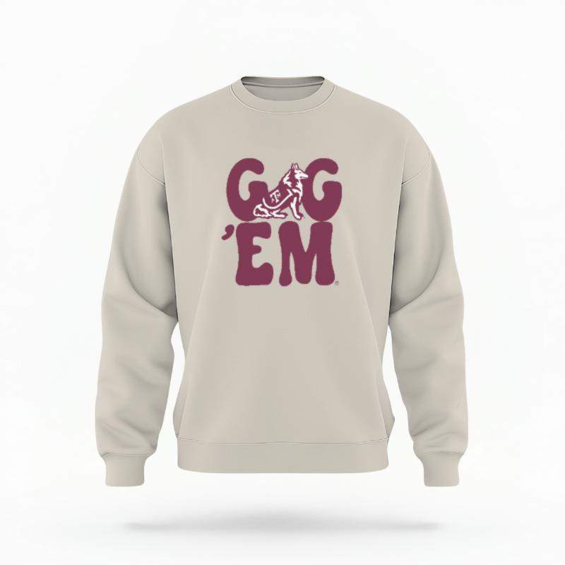 The Sand Unisex Gig 'Em Retro Reveille Crewneck Sweatshirt is set against a Ghost - White Studio background. The Gig 'Em Retro Reveille graphic is in a Sports Graphics style.