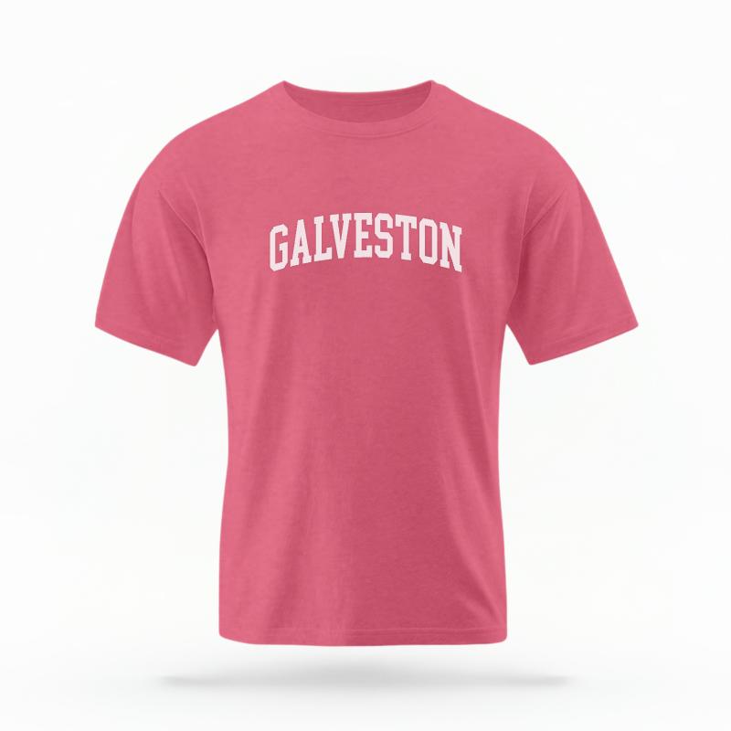 The Watermelon Unisex Galveston Varsity T-shirt is set against a Ghost - White Studio background. The Galveston Varsity graphic is in a Varsity style.