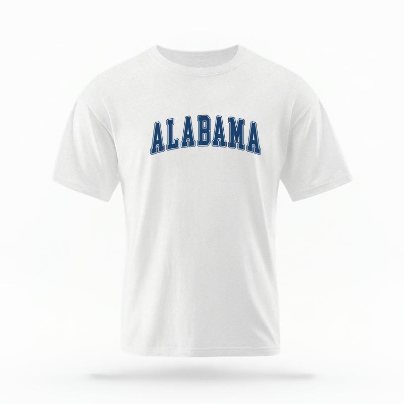 The White Unisex Alabama Varsity T-shirt is set against a Ghost - White Studio background. The Alabama Varsity graphic is in a Varsity style.