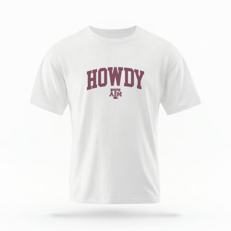 The White Unisex Howdy Varsity T-shirt is set against a Ghost - White Studio background. The Howdy Varsity graphic is in a Varsity style.