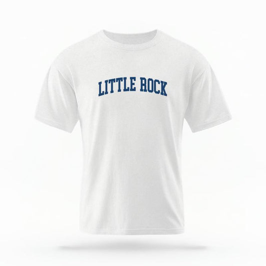 The White Unisex Little Rock AR Varsity T-shirt is set against a Ghost - White Studio background. The Little Rock AR Varsity graphic is in a Varsity style.