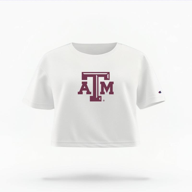 The White Female Texas A&M Logo Women's Boxy Crop Top is set against a Ghost - White Studio background. The Texas A&M Logo graphic is in a Logo style.