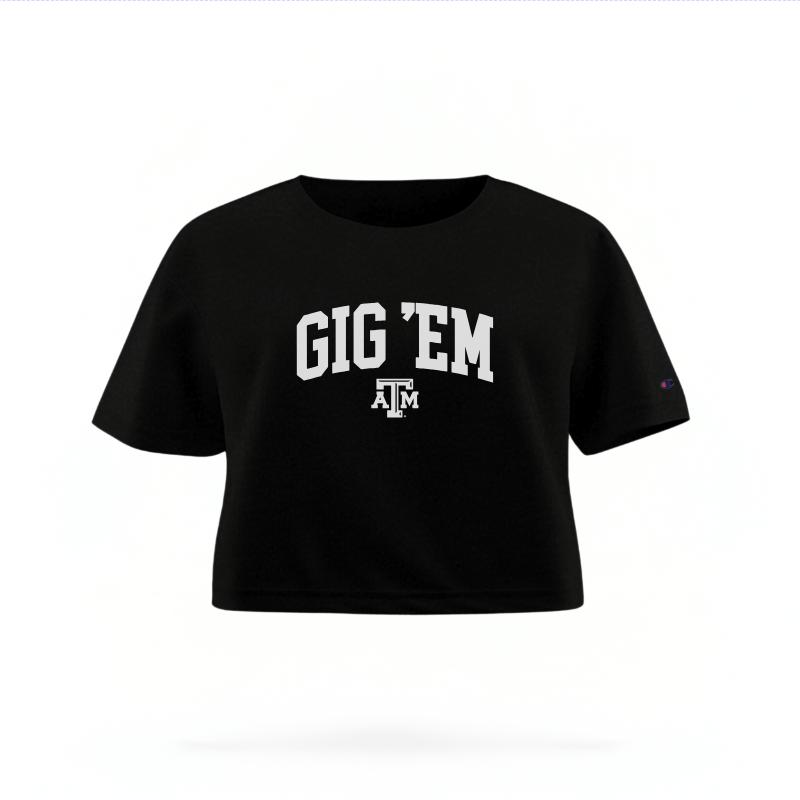 The Black Female Gig 'Em Varsity Women's Boxy Crop Top is set against a Ghost - White Studio background.  The Gig 'Em Varsity graphic is in a Sports Graphics style. 