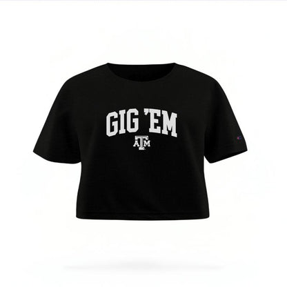 The Black Female Gig 'Em Varsity Women's Boxy Crop Top is set against a Ghost - White Studio background.  The Gig 'Em Varsity graphic is in a Sports Graphics style. 