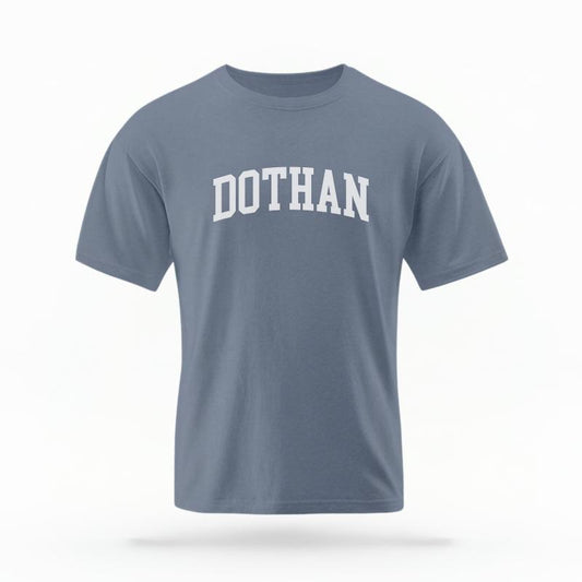 The Blue Jean Unisex Dothan, AL Varsity T-shirt is set against a Ghost - White Studio background.  The Dothan, AL Varsity graphic is in a Varsity style. 