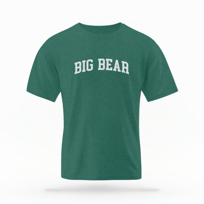 The Blue Spruce Unisex Big Bear CA Varsity T-shirt is set against a Ghost - White Studio background.  The Big Bear CA Varsity graphic is in a Varsity style. 
