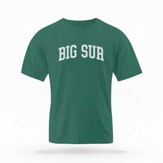 The Blue Spruce Unisex Big Sur CA Varsity T-shirt is set against a Ghost - White Studio background.  The Big Sur CA Varsity graphic is in a Varsity style. 