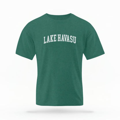 The Blue Spruce Unisex Lake Havasu AZ Varsity T-shirt is set against a Ghost - White Studio background.  The Lake Havasu AZ Varsity graphic is in a Varsity style. 