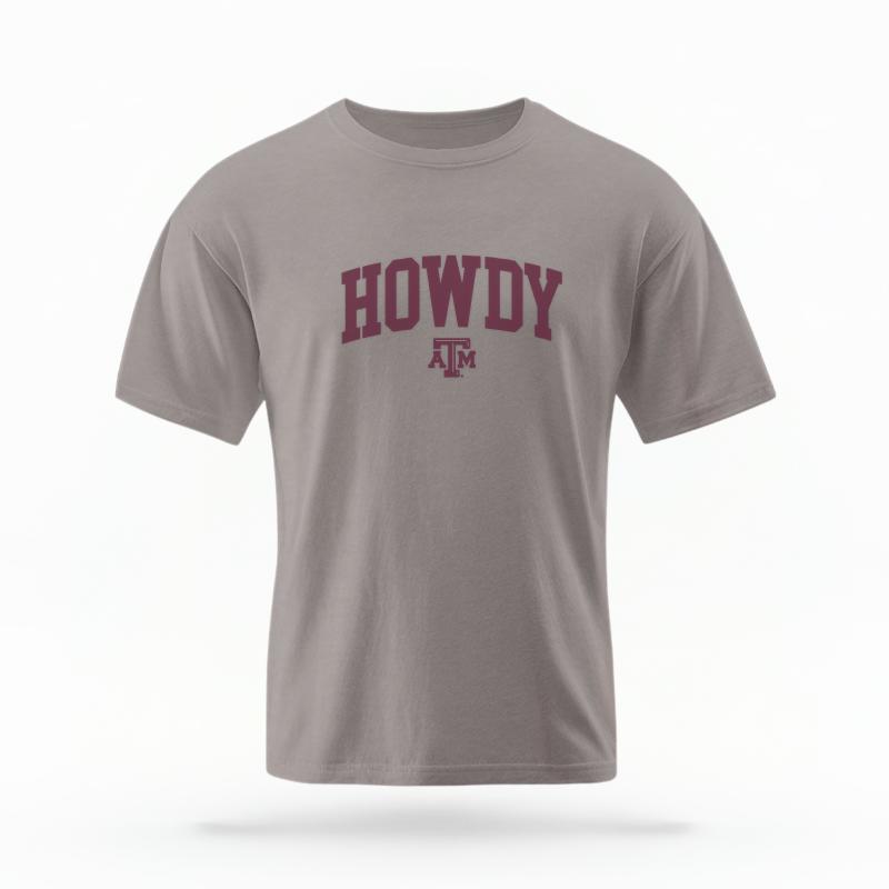 The Grey Unisex Howdy Varsity T-shirt is set against a Ghost - White Studio background.  The Howdy Varsity graphic is in a Varsity style. 