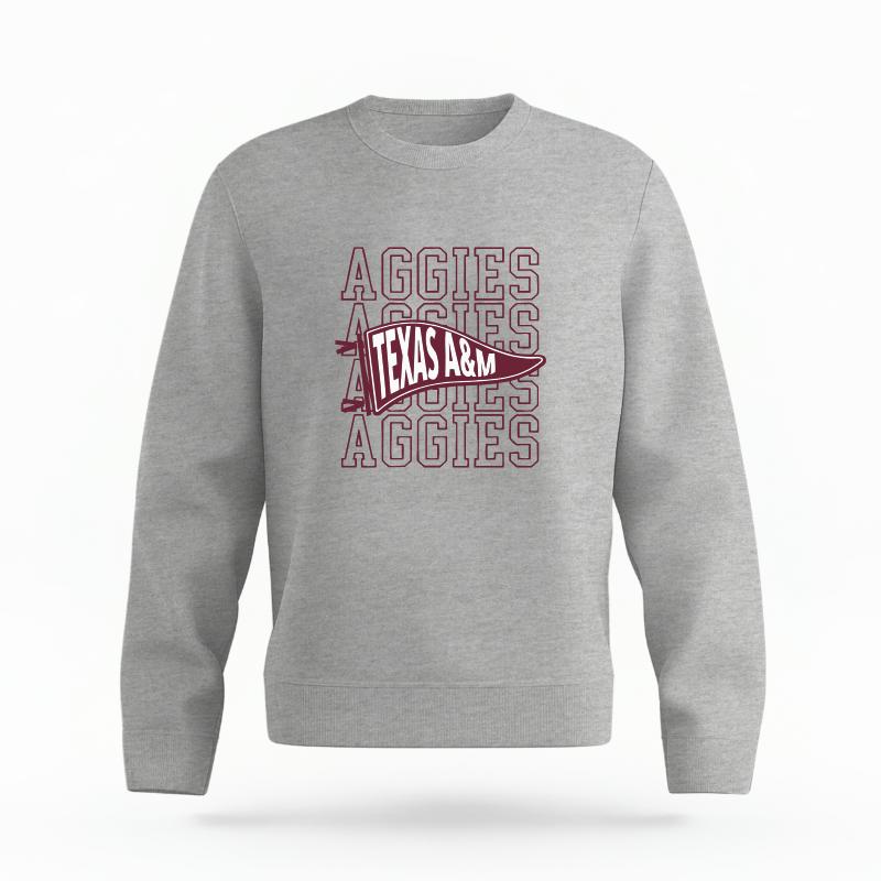 The Heather Grey Unisex Aggies Pennant Organic Cotton Crewneck is set against a Ghost - White Studio background.  The Aggies Pennant graphic is in a Sports Graphics style. 