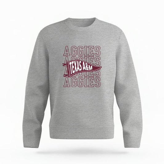 The Heather Grey Unisex Aggies Pennant Organic Cotton Crewneck is set against a Ghost - White Studio background.  The Aggies Pennant graphic is in a Sports Graphics style. 