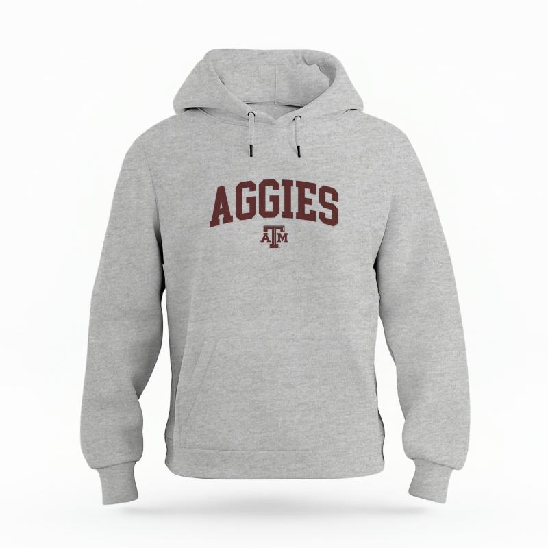 The Heather Grey Unisex Aggies Varsity Organic Cotton Hoodie is set against a Ghost - White Studio background.  The Aggies Varsity graphic is in a Sports Graphics style. 