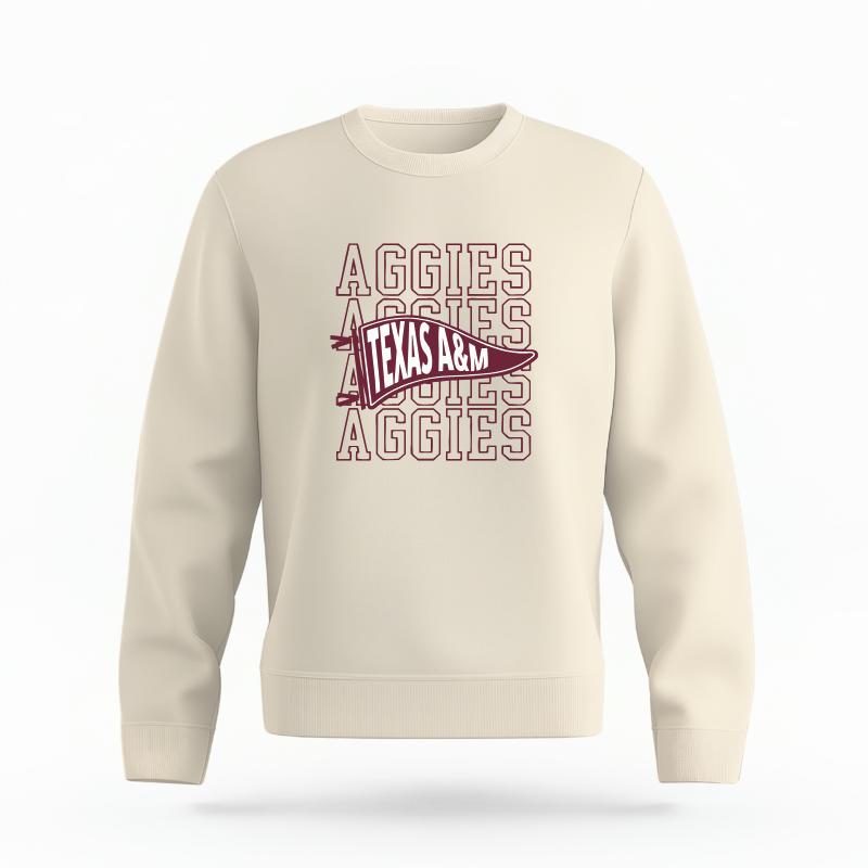 The Ivory Unisex Aggies Pennant Organic Cotton Crewneck is set against a Ghost - White Studio background.  The Aggies Pennant graphic is in a Sports Graphics style. 