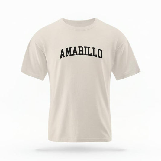 The Ivory Unisex Amarillo Varsity T-shirt is set against a Ghost - White Studio background.  The Amarillo Varsity graphic is in a Varsity style. 