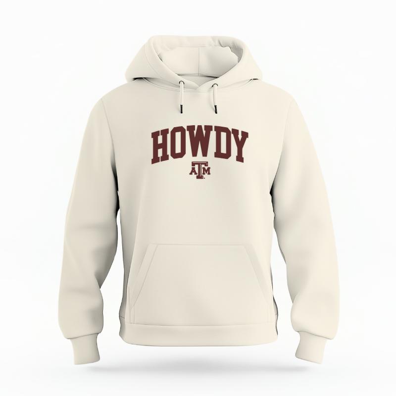 The Ivory Unisex Howdy Varsity Organic Cotton Hoodie is set against a Ghost - White Studio background.  The Howdy Varsity graphic is in a Sports Graphics style. 