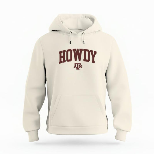 The Ivory Unisex Howdy Varsity Organic Cotton Hoodie is set against a Ghost - White Studio background.  The Howdy Varsity graphic is in a Sports Graphics style. 