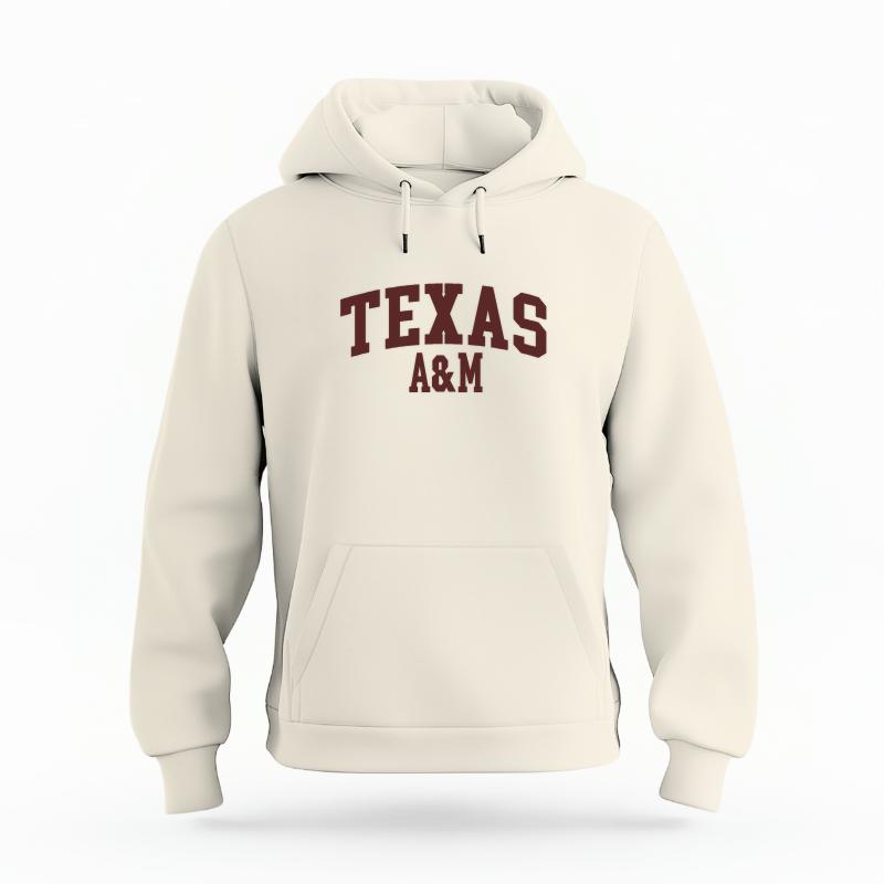 The Ivory Unisex Texas A&M Varsity Organic Cotton Hoodie is set against a Ghost - White Studio background.  The Texas A&M Varsity graphic is in a Sports Graphics style. 
