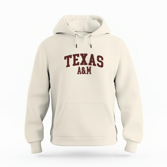 The Ivory Unisex Texas A&M Varsity Organic Cotton Hoodie is set against a Ghost - White Studio background.  The Texas A&M Varsity graphic is in a Sports Graphics style. 