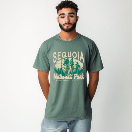 The Light Green Unisex Sequoia National Park T-shirt is set against a Model - White Studio background.  The Sequoia National Park graphic is in a National Parks style. 