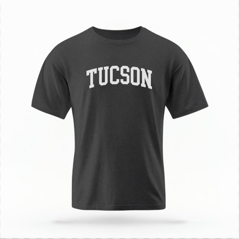 The Pepper Unisex Tucson AZ Varsity T-shirt is set against a Ghost - White Studio background.  The Tucson AZ Varsity graphic is in a Varsity style. 