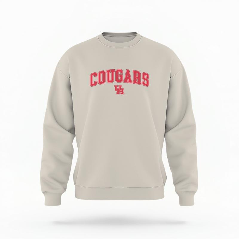The Sand Unisex Cougars Varsity Crewneck Sweatshirt is set against a Ghost - White Studio background.  The Cougars Varsity graphic is in a Varsity style. 