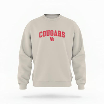 The Sand Unisex Cougars Varsity Crewneck Sweatshirt is set against a Ghost - White Studio background.  The Cougars Varsity graphic is in a Varsity style. 