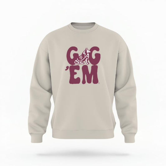 The Sand Unisex Gig 'Em Retro Reveille Crewneck Sweatshirt is set against a Ghost - White Studio background.  The Gig 'Em Retro Reveille graphic is in a Sports Graphics style. 