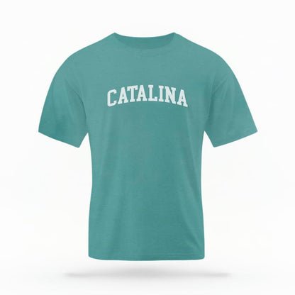 The Seafoam Unisex Catalina CA Varsity T-shirt is set against a Ghost - White Studio background.  The Catalina CA Varsity graphic is in a Varsity style. 