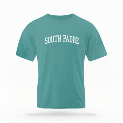 The Seafoam Unisex South Padre Varsity T-shirt is set against a Ghost - White Studio background.  The South Padre Varsity graphic is in a Varsity style. 