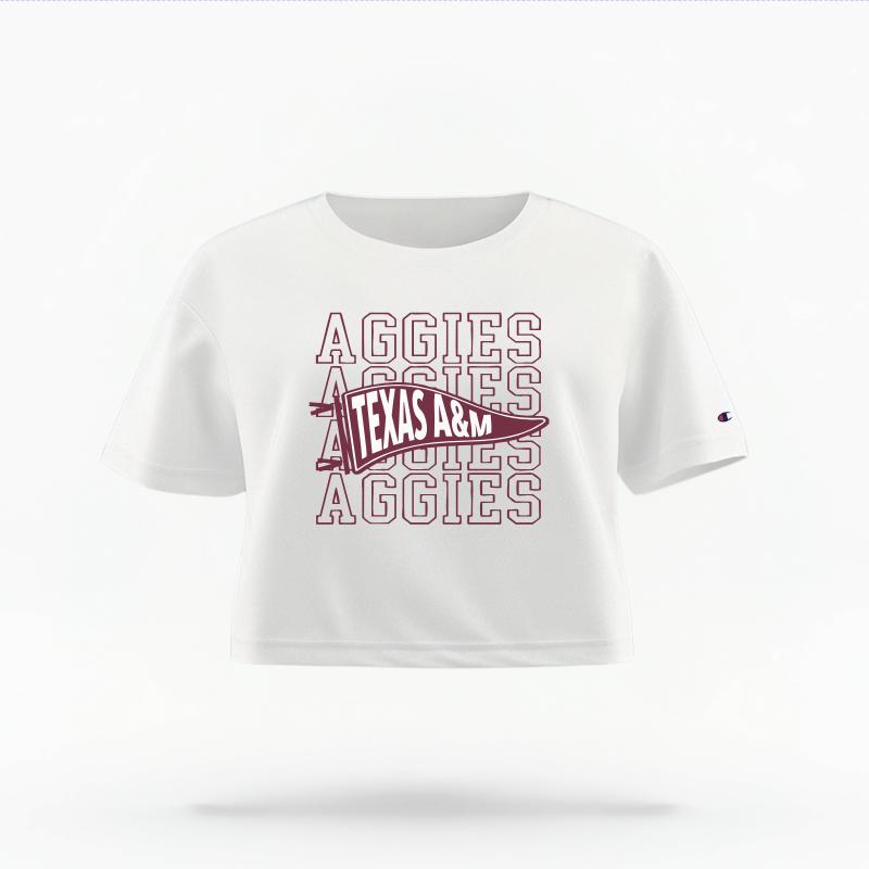 The White Female Aggies Pennant Women's Boxy Crop Top is set against a Ghost - White Studio background.  The Aggies Pennant graphic is in a Sports Graphics style. 