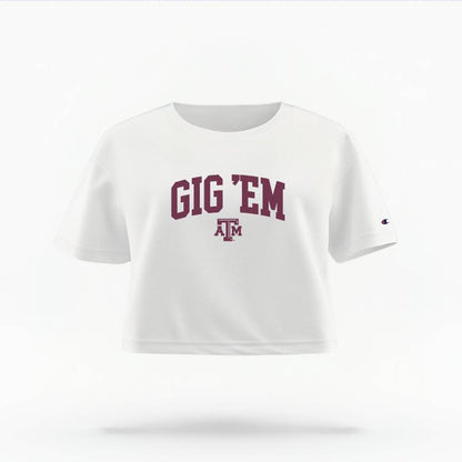 The White Female Gig 'Em Varsity Women's Boxy Crop Top is set against a Ghost - White Studio background.  The Gig 'Em Varsity graphic is in a Sports Graphics style. 