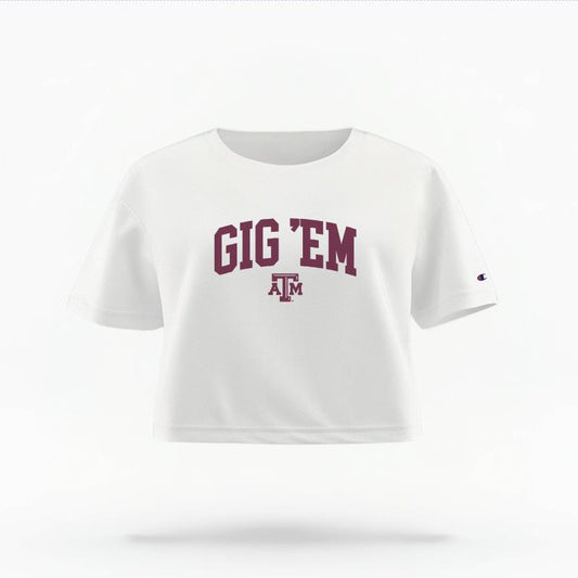 The White Female Gig 'Em Varsity Women's Boxy Crop Top is set against a Ghost - White Studio background.  The Gig 'Em Varsity graphic is in a Sports Graphics style. 