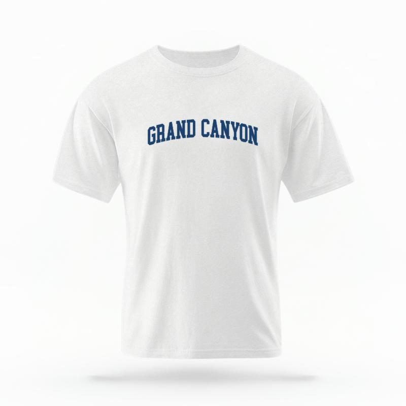 The White Unisex Grand Canyon AZ Varsity T-shirt is set against a Ghost - White Studio background.  The Grand Canyon AZ Varsity graphic is in a Varsity style. 