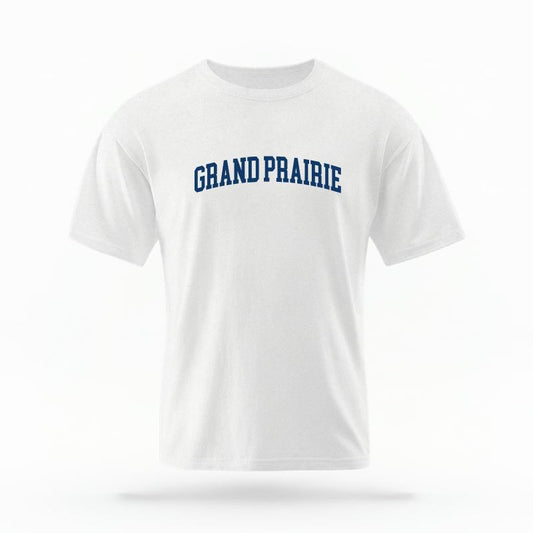 The White Unisex Grand Prairie Texas T-shirt is set against a Ghost - White Studio background.  The Grand Prairie Texas graphic is in a Varsity style. 