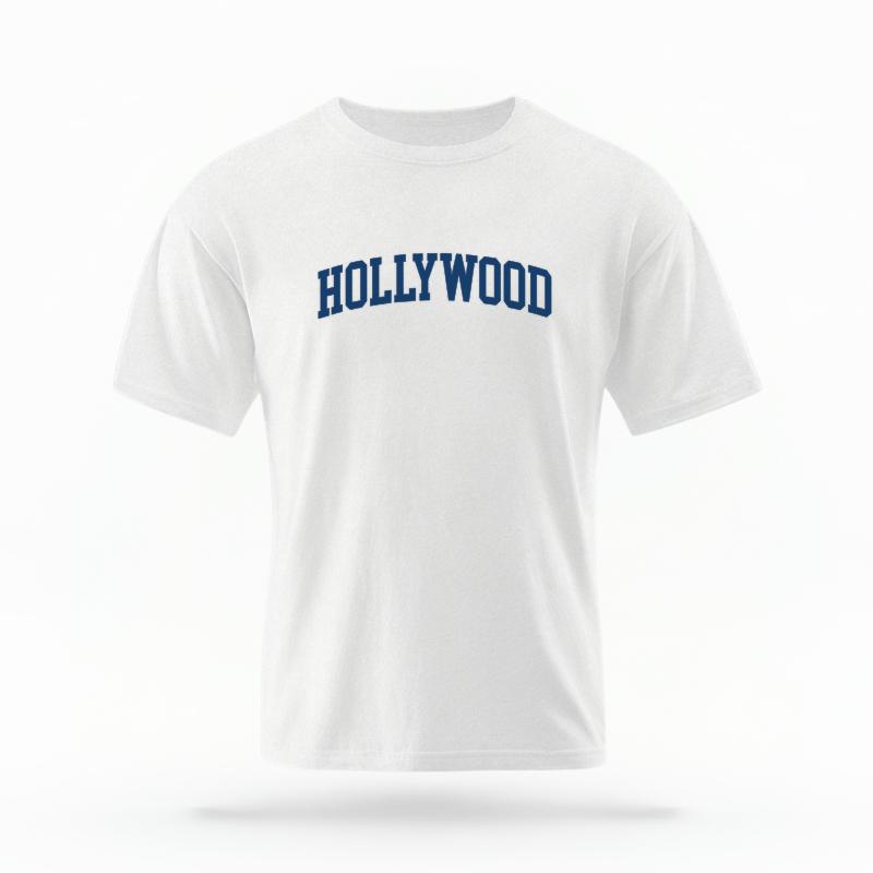 The White Unisex Hollywood CA Varsity T-shirt is set against a Ghost - White Studio background.  The Hollywood CA Varsity graphic is in a Varsity style. 