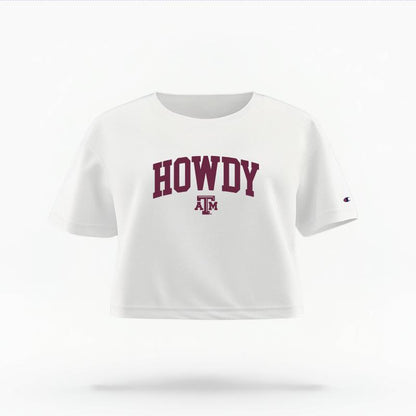 The White Female Howdy Varsity Women's Boxy Crop Top is set against a Ghost - White Studio background.  The Howdy Varsity graphic is in a Sports Graphics style. 