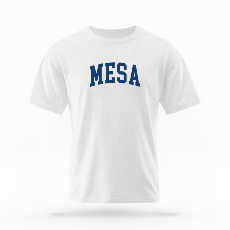 The White Unisex Mesa AZ Varsity T-shirt is set against a Ghost - White Studio background.  The Mesa AZ Varsity graphic is in a Varsity style. 