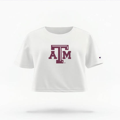 The White Female Texas A&M Logo Women's Boxy Crop Top is set against a Ghost - White Studio background.  The Texas A&M Logo graphic is in a Logo style. 