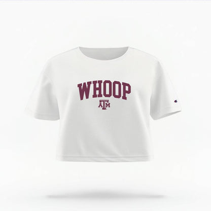 The White Female Whoop Varsity Women's Boxy Crop Top is set against a Ghost - White Studio background.  The Whoop Varsity graphic is in a Sports Graphics style. 