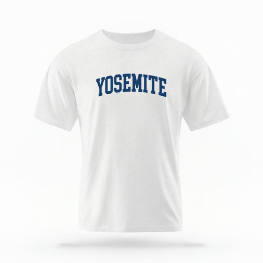 The White Unisex Yosemite CA Varsity T-shirt is set against a Ghost - White Studio background.  The Yosemite CA Varsity graphic is in a Varsity style. 